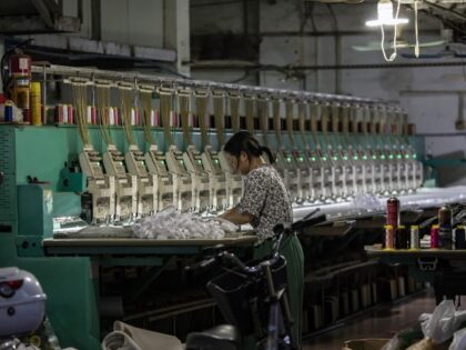 A worker at a textile workshop in Guangzhou, China, on Thursday, Aug. 10, 2023. China's central bank unexpectedly reduced a key interest rate by the most since 2020 to bolster an economy that's facing fresh risks from a worsening property slump and weak consumer spending. (Qilai Shen/Bloomberg via Getty)