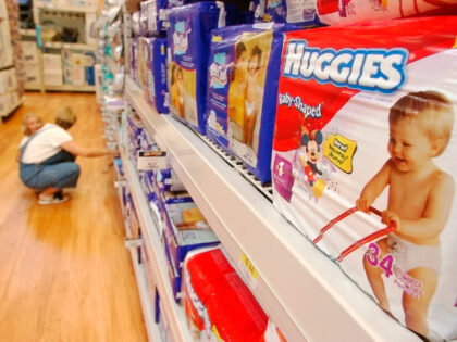 In this Aug. 24, 2004 file photo a shopper and her child look at diapers at a store in Little Rock, Ark. (AP Photo/Danny Johnston, File)