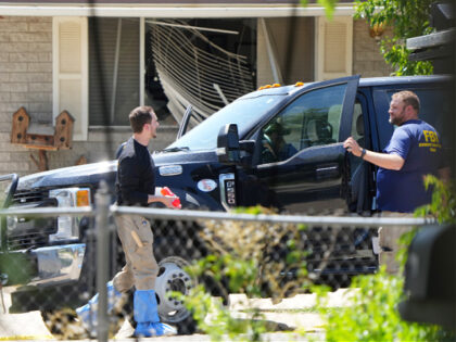 PROVO, UTAH - AUGUST 9: FBI process the home of Craig Robertson who was shot and killed by