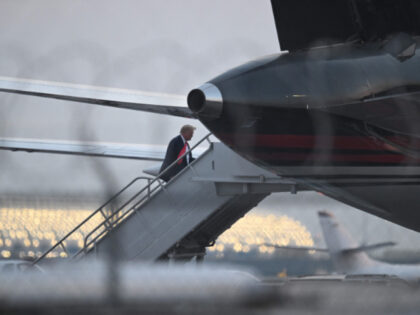 Former US President Donald Trump boards his plane Trump Force One as he departs Atlanta Hartsfield-Jackson International Airport in Atlanta, Georgia, on August 24, 2023. Former US president Donald Trump was photographed for a police mug shot after his arrest on August 24 at the Fulton County Jail in Georgia, …