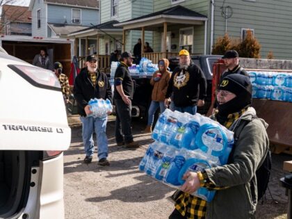 EAST PALESTINE, OH - FEBRUARY 25: A local chapter of the Proud Boys hand out water, food,