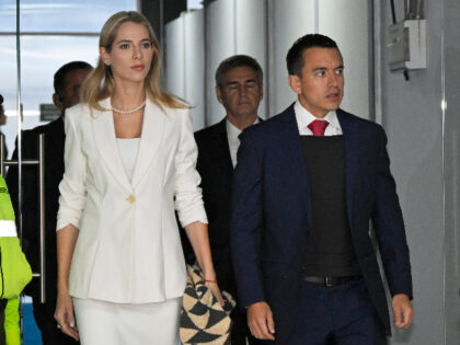 Ecuadorian presidential candidate Daniel Noboa, wearing a bulletproof vest and accompanied by his wife Lavinia Valbonesi, arrives to the Ecuador TV headquarters before the beginning of the presidential debate in Quito, on August 13, 2023. (Photo by Rodrigo BUENDIA / AFP) (Photo by RODRIGO BUENDIA/AFP via Getty Images)