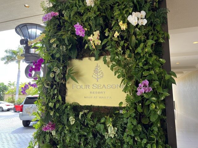 FEMA - Engraved sign among orchids at entrance at the Four Seasons Resort Maui at Wailea,