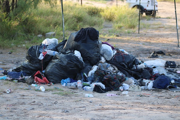 Garbage left by migrant groups crossing in Eagle Pass. (Randy Clark/Breitbart Texas)