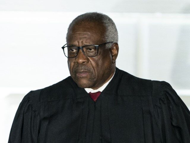 Clarence Thomas, associate justice of the U.S. Supreme Court, listens during a ceremony on