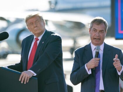 US President Donald Trump listens as Nigel Farage (R) speaks during a Make America Great Again rally at Phoenix Goodyear Airport October 28, 2020, in Goodyear, Arizona. (Photo by Brendan Smialowski / AFP) (Photo by BRENDAN SMIALOWSKI/AFP via Getty Images)