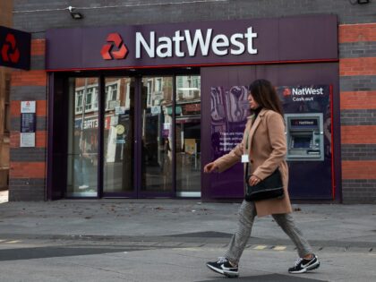 A member of the public walks past a branch of NatWest bank on 28 October 2022 in Slough, United Kingdom. High street banks including HSBC, NatWest and Lloyds continue to close branches. (photo by Mark Kerrison/In Pictures via Getty Images)