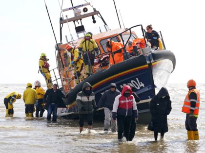 A group of people thought to be migrants are brought in to Dungeness, Kent, from the RNLI