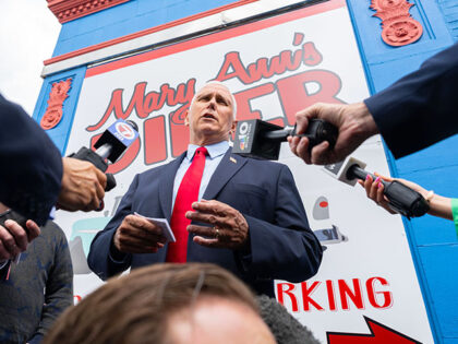Former US Vice President Mike Pence speaks to members of the media during a campaign stop