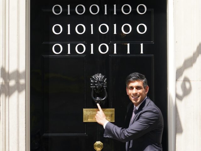 Prime Minister Rishi Sunak stands at the door of 10 Downing Street, London, as numbers stu