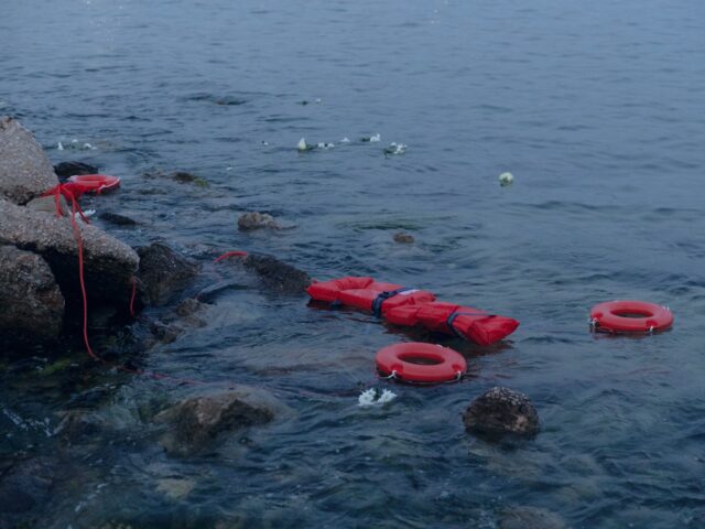 PIRAEUS, GREECE - JUNE 20: Communist's Party Youth throws lifebuoys into the sea as a symb