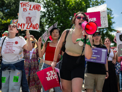 Abortion rights demonstrators rally to mark the first anniversary of the US Supreme Court ruling in the Dobbs v Women's Health Organization case in Washington, DC on June 24, 2023. A year after US Supreme Court scrapped the constitutional right to abortion in the United States, President Joe Biden on …