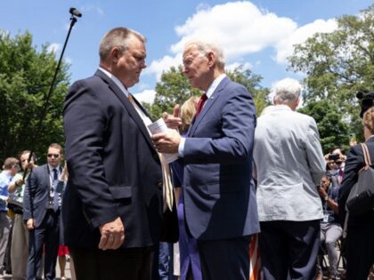 WASHINGTON, DC - JUNE 24: President Joe Biden (R) talks to Sen. Jon Tester (D-MT) after sp