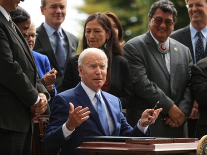 WASHINGTON, DC - OCTOBER 08: U.S. President Joe Biden finishes signing an executive order