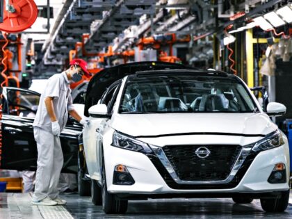 XIANGYANG, CHINA - AUGUST 04: Employees work on the assembly line of Altima sedan at the Xiangyang plant of Dongfeng Nissan Passenger Vehicle Company on August 4, 2022 in Xiangyang, Hubei Province of China. (Photo by Yang Dong/VCG via Getty Images)