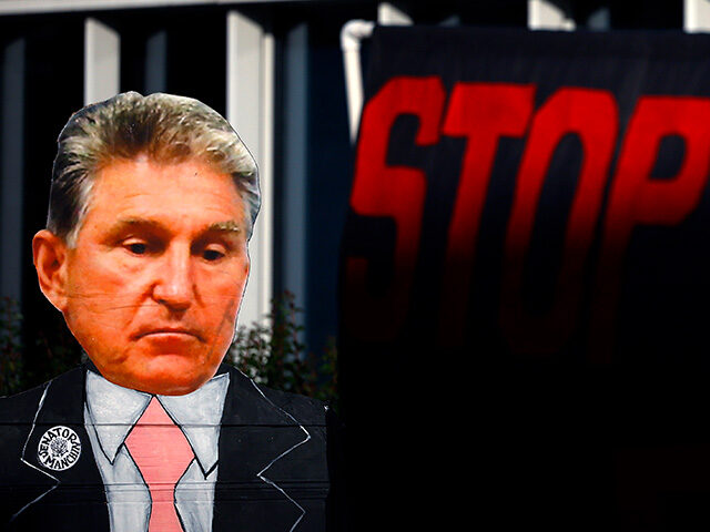 Climate activists hold a protest against Sen. Joe Manchin (D-WV) outside of the Federal En