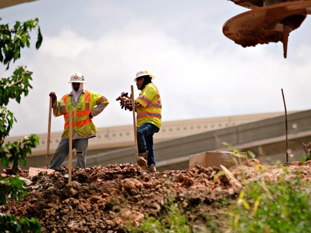 US-CLIMATE-LABOR-WEATHER-HEAT-WAVE Construction workers rebuild the I-69 Southwest/I-610 West Loop Interchange during a heat