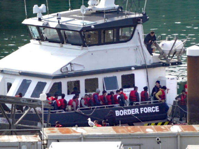 A group of people thought to be migrants are brought in to Dover, Kent, from a Border Forc