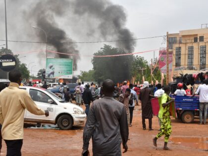 A general view of billowing smoke as supporters of the Nigerien defence and security forces attack the headquarters of the Nigerien Party for Democracy and Socialism (PNDS), the party of overthrown President Mohamed Bazoum, in Niamey on July 27, 2023. The head of Niger's armed forces on July 27, 2023 …