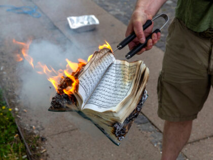 COPENHAGEN, DENMARK - JULY 28: A Quran is burned by an activist from the small right-wing group, Danish Activists, on July 28, 2023 in Copenhagen, Denmark. Six Quran burnings were planned to be held in Copenhagen this Friday, with this one being held directly across from a mosque where Friday …