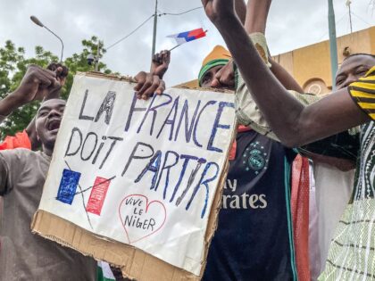 Protesters hold an anti-France placard during a demonstration on independence day in Niamey on August 3, 2023. Security concerns built on August 3, 2023 ahead of planned protests in coup-hit Niger, with France demanding safety guarantees for foreign embassies as some Western nations reduced their diplomatic presence. (Photo by AFP) …
