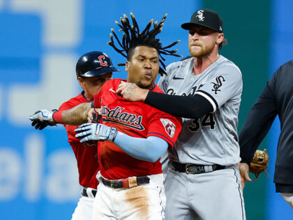 Jose Ramirez #11 of the Cleveland Guardians is held by Michael Kopech #34 of the Chicago White Sox during a fight in the sixth inning at Progressive Field on August 05, 2023 in Cleveland, Ohio. (Photo by Ron Schwane/Getty Images)