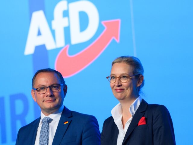 06 August 2023, Saxony-Anhalt, Magdeburg: Tino Chrupalla (l), AfD federal chairman and chair of the AfD parliamentary group, and Alice Weidel, AfD federal chairman and chair of the AfD parliamentary group, speak to each other on stage at the AfD European Election Convention. The delegates continued in Magdeburg the second …