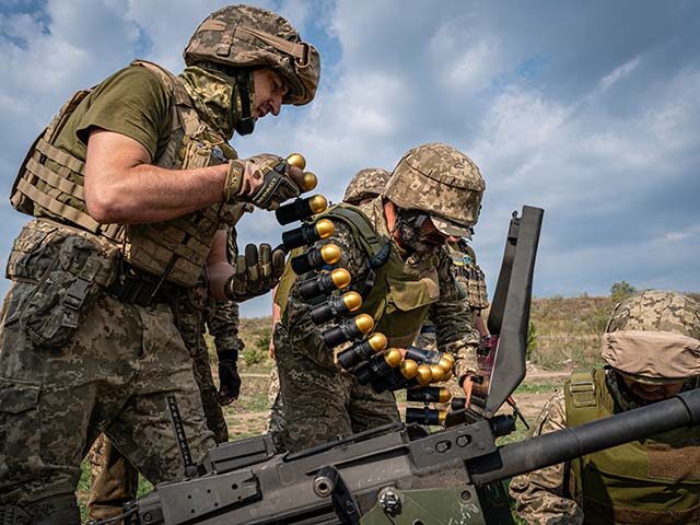 Ukrainian soldiers load a grenade launcher ammunition as Russia-Ukraine war continues in D