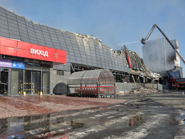 ODESA, UKRAINE - AUGUST 14, 2023 - Rescuers put out a fire at one of the biggest hypermarkets caused by the Russian overnight strike, Odesa, southern Ukraine. Russians attacked Odesa three times in the early hours of Monday, deploying 15 one-way attack drones and eight Kalibr-type sea-based missiles that were …
