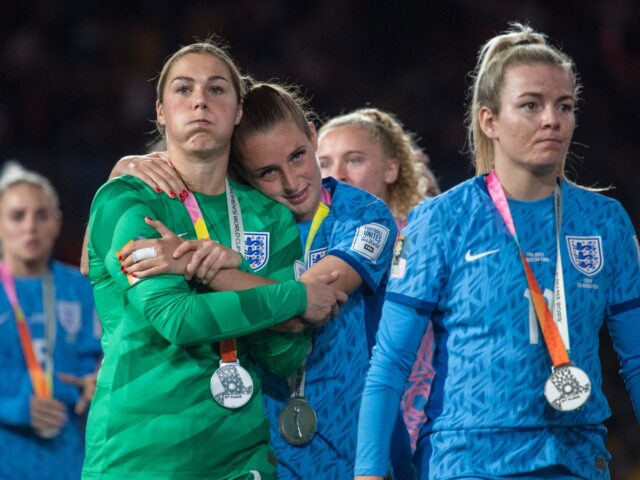 SYDNEY, AUSTRALIA - AUGUST 20: Mary Earps of England (L) is hugged by Ella Toone of England at the ceremony following the FIFA Women's World Cup Australia & New Zealand 2023 Final match between Spain and England at Stadium Australia on August 20, 2023 in Sydney, Australia. (Photo by Will …