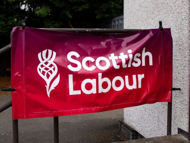 A Scottish Labour sign outside the party's Rutherglen and Hamilton West campaign center in