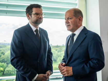 23 August 2023, Berlin: Chancellor Olaf Scholz (SPD, r), talks with Marco Buschmann (FDP),