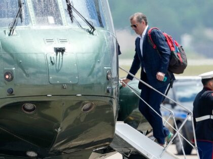 Hunter Biden boards Marine One after President Joe Biden boarded as they leave Andrews Air
