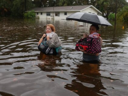 Hurricane Idalia Slams Into Florida's Gulf Coast TARPON SPRINGS, FLORIDA - AUGUST 30: Makatla Ritchter (L) and her mother, Keiphra Line wade through flood waters after having to evacuate their home when the flood waters from Hurricane Idalia inundated it on August 30, 2023 in Tarpon Springs, Florida. Hurricane Idalia …