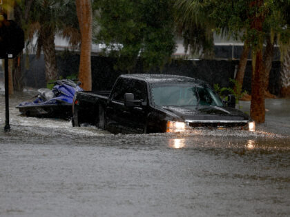 TARPON SPRINGS, FLORIDA - AUGUST 30: A truck passes through flooded streets caused by Hurricane Idalia passing offshore on August 30, 2023 in Tarpon Springs, Florida. Hurricane Idalia is hitting the Big Bend area of Florida. (Photo by Joe Raedle/Getty Images)