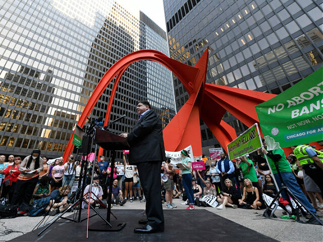 Illinois Gov. J.B. Pritzker, center, speaks during a Pro-Choice rally at Federal Plaza, Fr