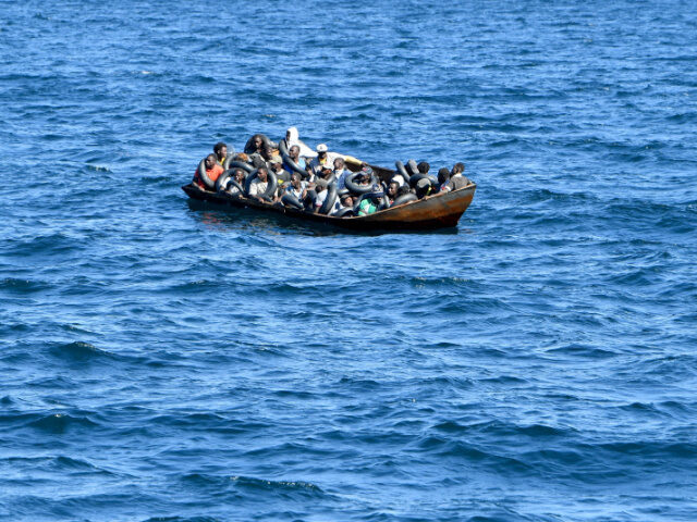 Migrants of African origin trying to flee to Europe are crammed on board of a small boat,