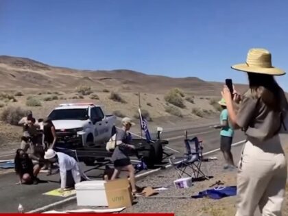 Nevada Tribal Ranger plows through activists' highway protest.