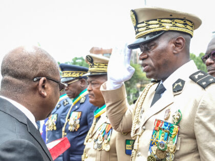 Head of Gabon's elite Republican Guard, General Brice Oligui Nguema (R), is decorated