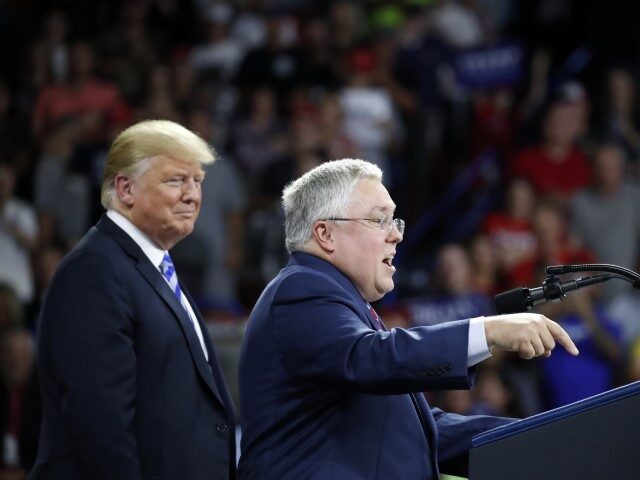 President Donald Trump, left, listens as Republican Senate candidate Patrick Morrisey, currently West Virginia Attorney General, speaks during a rally Tuesday, Aug. 21, 2018, in Charleston, W.Va. (Alex Brandon/AP)