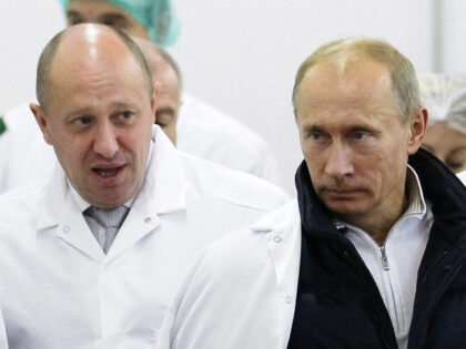 FILE - Businessman Yevgeny Prigozhin, left, shows Russian President Vladimir Putin, around his factory which produces school meals, outside St. Petersburg, Russia on Sept. 20, 2010. Prigozhin made his name as the profane and brutal mercenary boss who mounted an armed rebellion that was the most severe and shocking challenge …
