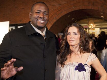 NEW ORLEANS - NOVEMBER 19: Actor Quinton Aaron and actress Sandra Bullock attend "The Blin