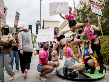 BURBANK, CALIFORNIA - JUNE 15: Star Garden Topless Dive Bar dancers pose after performing and standing in solidarity with striking WGA (Writers Guild of America) employees on the picket line on June 15, 2023 in Burbank, California. Dancers at the North Hollywood bar have become the only unionized group of …