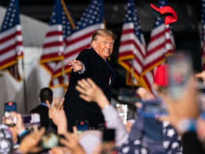 Former U.S. President Donald Trump tosses a hat into the crowd at a 'Save America' rally in Commerce, Georgia, U.S., on Saturday, March 26, 2022. Trump is focusing most of his ire over losing the 2020 election on Georgia, where he will put his status as a GOP kingmaker on …