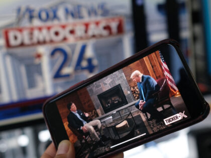 TOPSHOT - This illustration photo shows a preview of Tucker Carlson's interview of former US President Donald Trump scheduled to air on X (formerly Twitter) on the same night of the first Republican Presidential primary debate in Milwaukee, Wisconsin, on a smartphone ahead of the debate on August 23, 2023. …