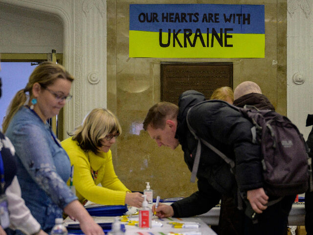 Ukrainian refugees sign in to attend a job fair in the Brooklyn borough of New York on Feb
