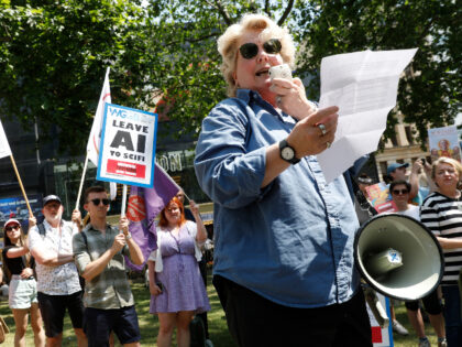 LONDON, ENGLAND - JUNE 14: Sandi Toksvig OBE speaks on a megaphone as the Writers Guild Of Great Britain joins a global strike in solidarity with the Writers' Guild of America West and Writers' Guild of America East at Leicester Square on June 14, 2023 in London, England. Writers of …