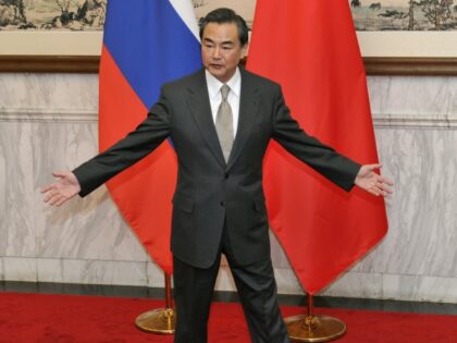 Chinese Foreign Minister Wang Yi greets Russian Foreign Minister Sergey Lavrov (not pictur