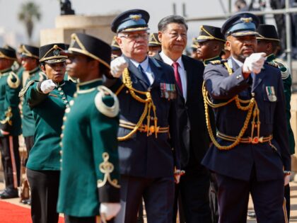 Chinese President Xi Jinping (C) inspects the guard of honour during his state visit to South Africa at the Union Buildings in Pretoria on August 22, 2023. (Photo by PHILL MAGAKOE / AFP) (Photo by PHILL MAGAKOE/AFP via Getty Images)