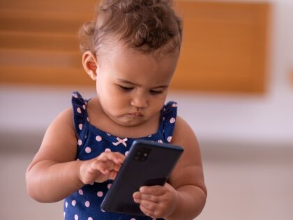 baby holding smartphone